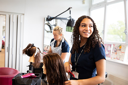 Hair students working in the classroom